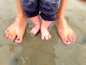 Baby and Mommy feet kissing Earth